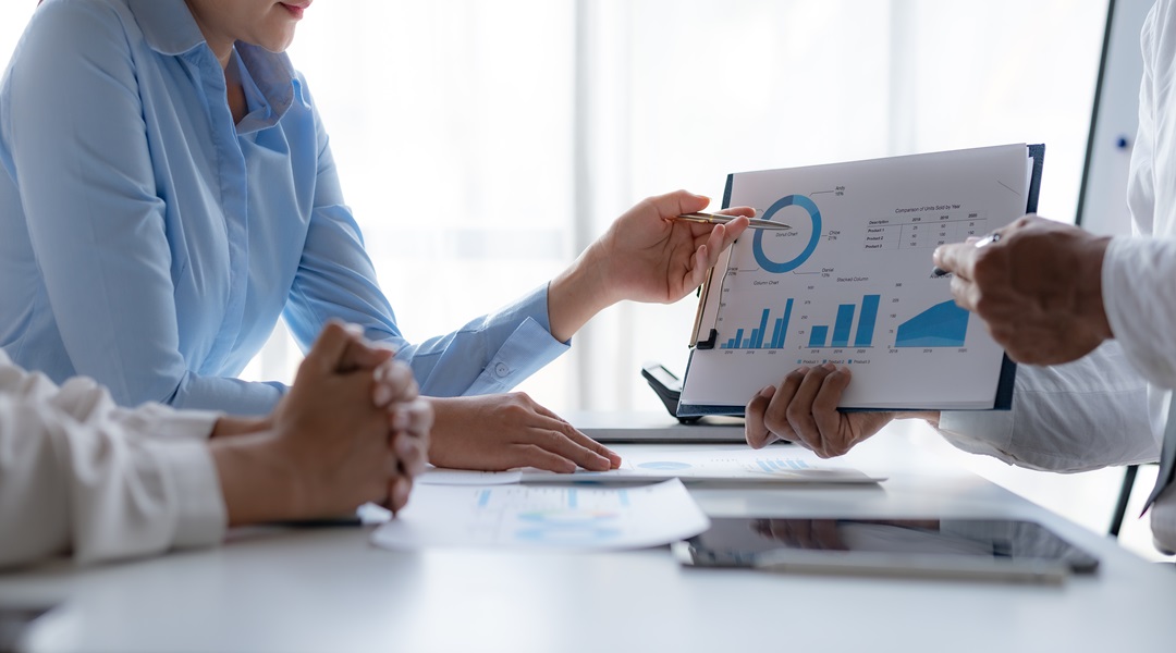 Business team together making investment plan at meeting pointin